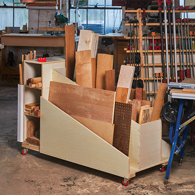 Cutoff cart filled with various wood scraps in a workshop setting.