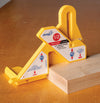 Yellow Micro Jig FitFinder 1/2 gauge tool measuring thickness of wood stock on table surface
