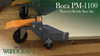 Close-up of Bora PM-1100 plywood mobile base kit with caster wheels and adjustable leveling feet on a workbench
