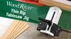 WoodRiver Thin Rip Tablesaw Jig clamped on table saw with thin wood strips cut nearby