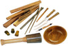 Various turned and carved Argentinean Lignum Vitae wood items including bowls, handles, and carving tools displayed on