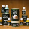 Various Rubio Monocoat wood finishing products including Oil Plus 2C, DuroGrit, Soap, Cleaner, and Accelerators on a wooden