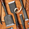 Japanese chisel set displayed on a workbench