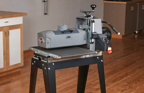 Metalworking machine on a stand in a workshop setting