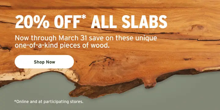 Wooden slab with promotional text for 20% off all slabs through March 31.